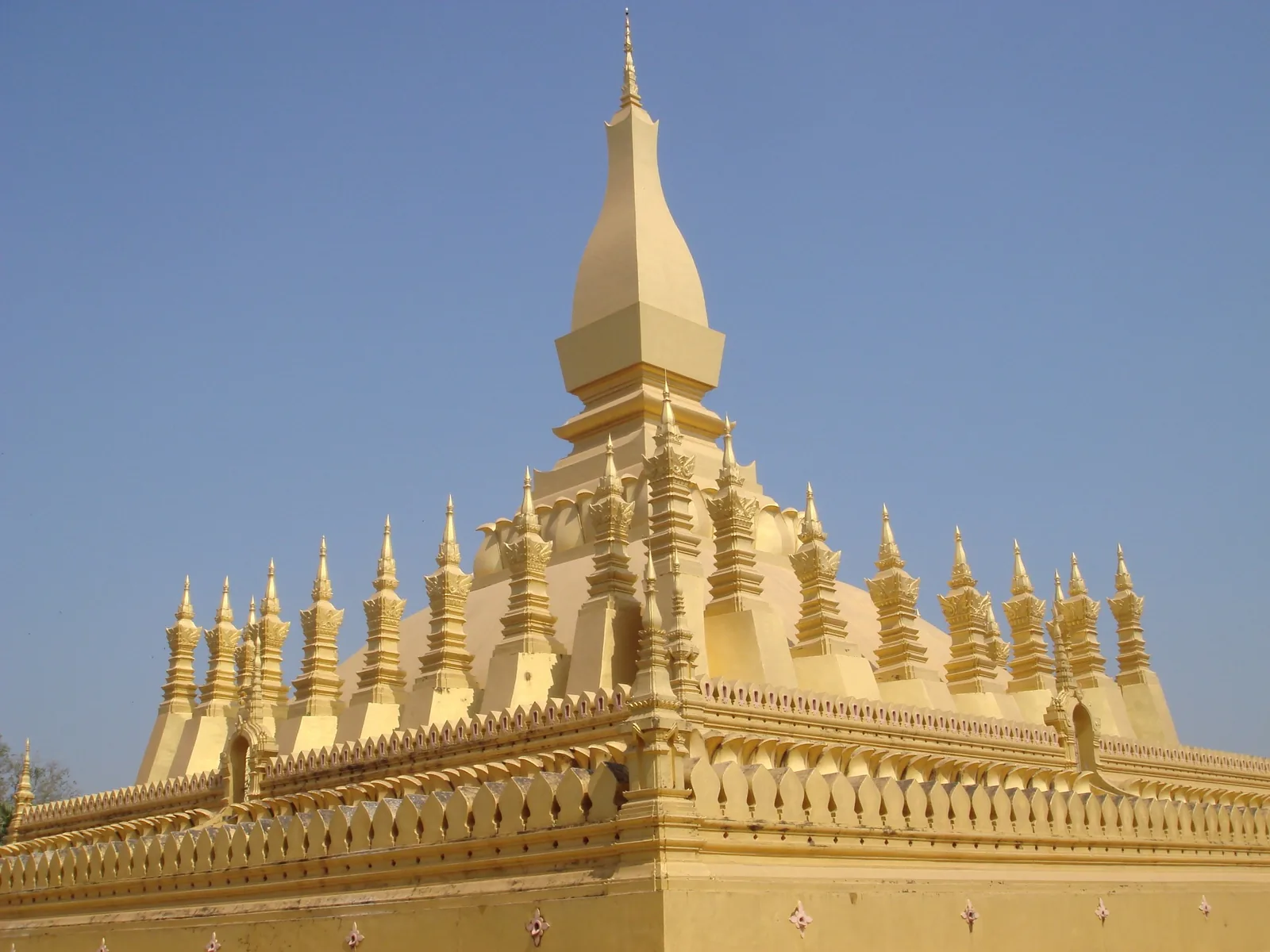 The golden stupa of Pha That Luang rises against a clear blue sky in Vientiane. The golden stupa of Pha That Luang rises against a clear blue sky in Vientiane.